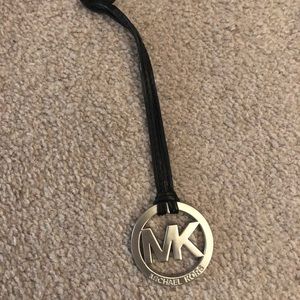 Authentic MK silver bag tag